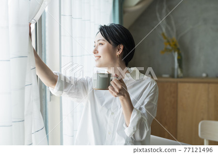 Woman taking a break during remote work Woman taking a break during remote work 77121496