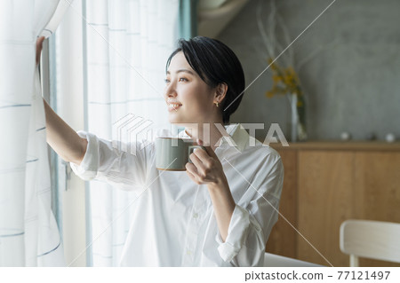 Woman taking a break during remote work 77121497