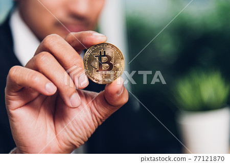 Business man hand holding show crypto bitcoin currency money 77121870