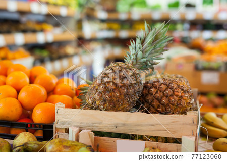 Picture of fresh variety pineapples on counter 77123060