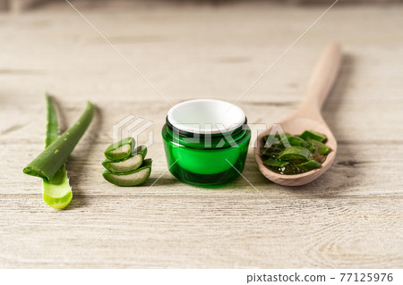 Fresh aloe vera plant, stem slices and gel. 77125976