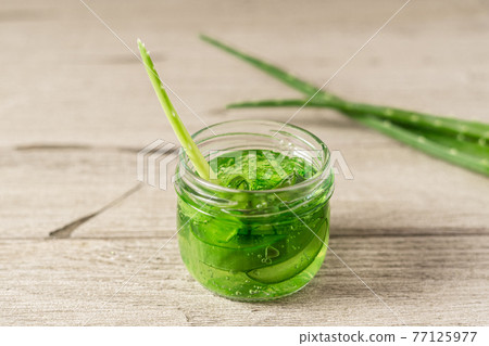 Fresh aloe vera plant, stem slices and gel. 77125977