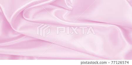 Smooth elegant pink silk or satin texture as wedding background. Luxurious background design Smooth elegant pink silk or satin texture as wedding background. Luxurious background design 77126574