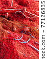 Red fishing nets with floats and ropes. Close-up shot, perfect image for fishing, aquaculture and environmental protection. 77126835