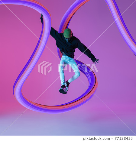 Stylish man with long fluid flood on gradient background. Negative space to insert your text. Modern design. Contemporary colorful and conceptual bright art collage. 77128433