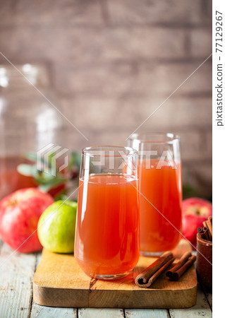 Glass of fresh apple juice Glass of fresh apple juice 77129267