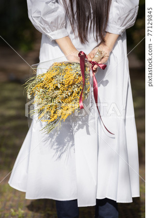 Woman with a bouquet Woman with a bouquet 77129845