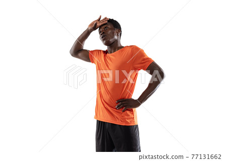 Portrait of African man, professional trackman isolated over white background. 77131662