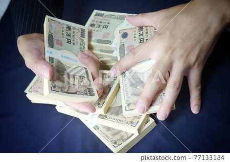 Money and a man in a suit Money and a man in a suit 77133184