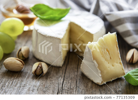 Camembert cheese with snacks 77135309