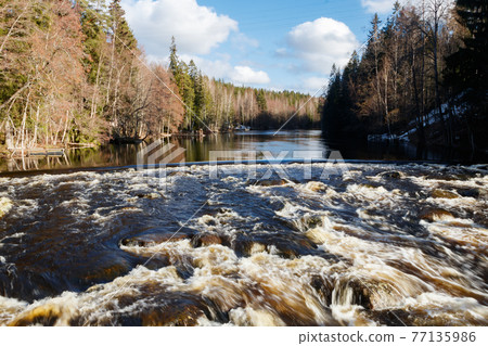 Long exposure photo. Dam and threshold on the river Jokelanjoki, Kouvola, Finland 77135986