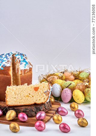 Easter pastry kulich and easter eggs. 77136008