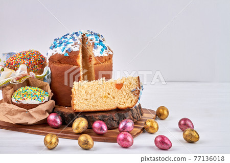 Piece of easter cake with white icing. 77136018