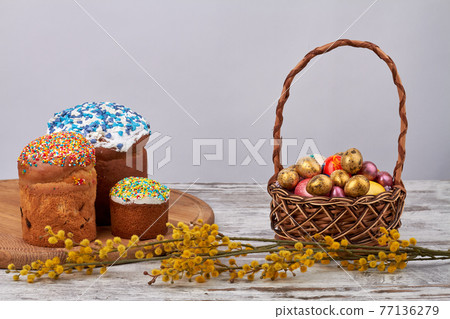 Sweet easter cakes with eggs and willow. 77136279