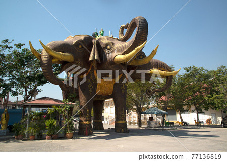 Large outdoor statue of Erawan elephant three headed in Wat Bang Chak , Thailand. Which made the entrance to the parking lot. 77136819
