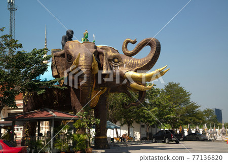 Large outdoor statue of Erawan elephant three headed in Wat Bang Chak , Thailand. Which made the entrance to the parking lot. 77136820