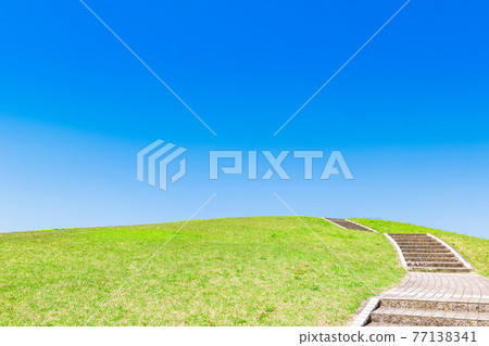 Blue sky and fresh green hills Blue sky and fresh green hills 77138341