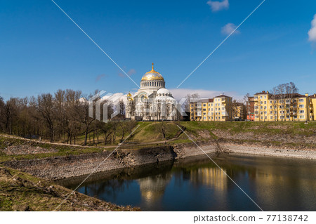 Russia. April 28, 2021. Spring view of the St. Nicholas Naval Cathedral on a fine sunny day from the Summer Garden in Kronstadt. 77138742