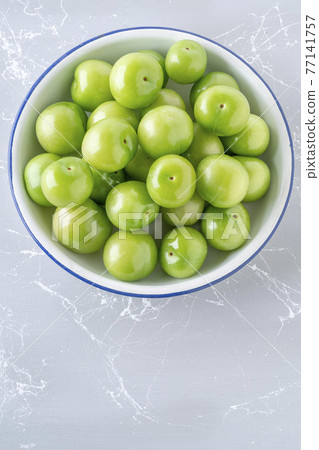 fresh green plum fruits on the table fresh green plum fruits on the table 77141757