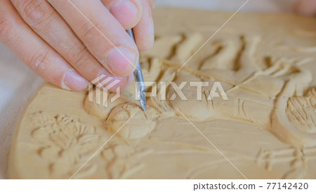 Potter making clay stamp picture Potter making clay stamp picture 77142420