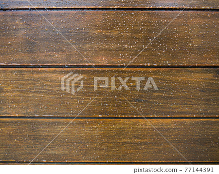 Many water drops on wooden surface Many water drops on wooden surface 77144391