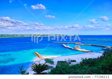 Miyakojima in midsummer. Landscape of Kurima Bridge and Kurima Port as seen from the Matsunoki Observatory on Kurima Island Miyakojima in midsummer. Landscape of Kurima Bridge and Kurima Port as seen from the Matsunoki Observatory on Kurima Island 77146211