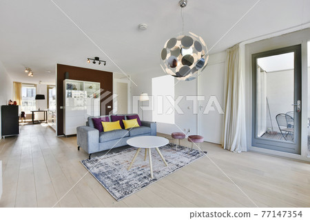 Living room with stylish furniture and lamp Living room with stylish furniture and lamp 77147354