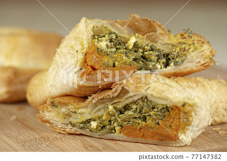 Spinach triangle with danish feta and pumpkin Spinach triangle with danish feta and pumpkin 77147382