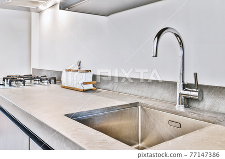 Modern washbasin under counter in kitchen 77147386