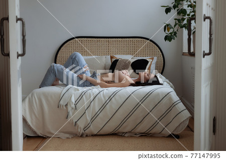 Sensual woman touching naked breast in bedroom Sensual woman touching naked breast in bedroom 77147995