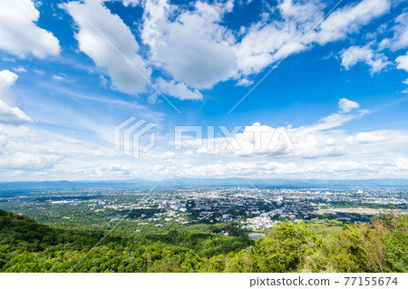 view in the mountains with cityscape over the city airatmosphere bright blue sky background abstract clear texture with white clouds. of Chiang Mai,Thailand view in the mountains with cityscape over the city airatmosphere bright blue sky background abstract clear texture with white clouds. of Chiang Mai,Thailand 77155674
