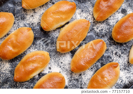 Homemade russian pirozhki, fresh baked patties or pies 77157710