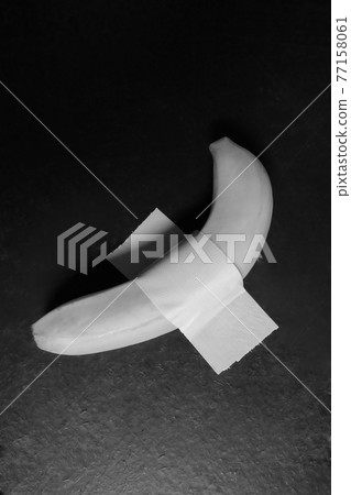 An interesting and amazing banana taped to the wall An interesting and amazing banana taped to the wall 77158061