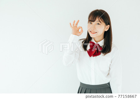 High school student doing an okay sign 77158667
