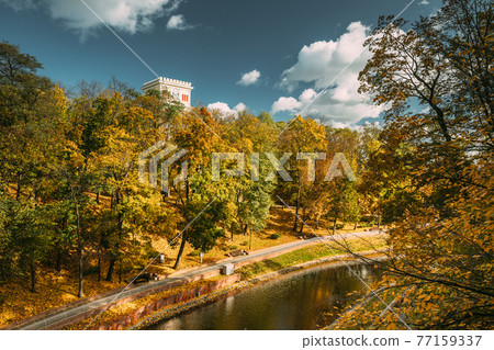 Gomel, Belarus. City Park In Autumn Season. Clock Tower Of Rumyantsevs And Paskeviches Palace And Pond In Homiel Park, Belarus. Famous Local Landmark In Autumn Season 77159337