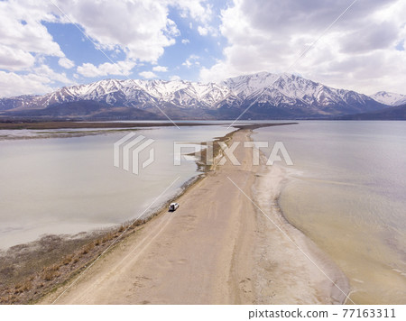 Thin Sandy Spit Coastline in Van Golu lake. Van is the largest lake in Turkey Thin Sandy Spit Coastline in Van Golu lake. Van is the largest lake in Turkey 77163311