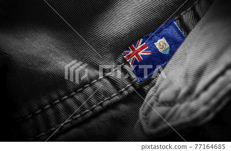Tag on dark clothing in the form of the flag of the Anguilla Tag on dark clothing in the form of the flag of the Anguilla 77164685