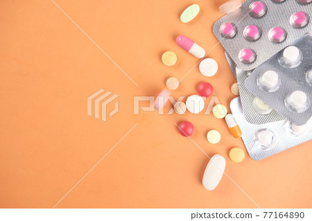Close up of many colorful pills and capsules  77164890