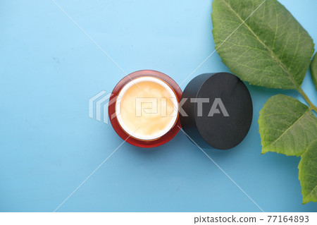 Close up of face cream in a container  77164893