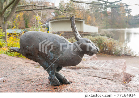 KOTKA, FINLAND - OCTOBER 23, 2018: Sculpture of rabbit on a rock in Sapokka Water Park in Kotka, Finland 77164934