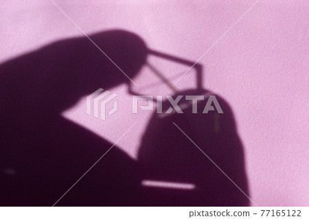 Shapes of shadow and light in an abstract background on pink 77165122