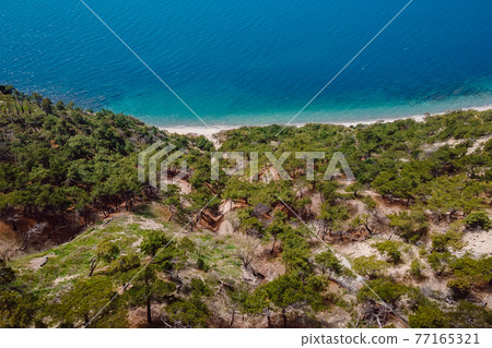 Aerial view of coastline with blue sea and highest cliff. Summer day on Black sea 77165321