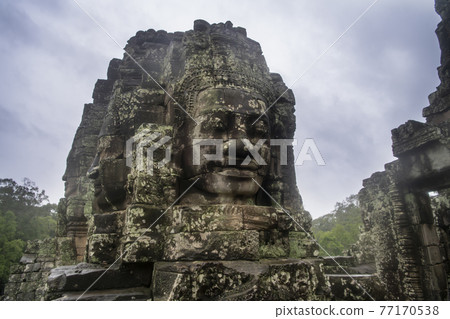 Bayon the central temple of Angkor Thom, late 12th century. It rains in the rainy season. (Cambodia, 04.10. 2019) Bayon the central temple of Angkor Thom, late 12th century. It rains in the rainy season. (Cambodia, 04.10. 2019) 77170538