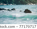 Powerful ocean waves breaking natural background..A Perfect big breaking Ocean barrel wave. .An ocean shorebreak in front view. Big beautiful green blue wave splashing with backwave and ready to break 77170717