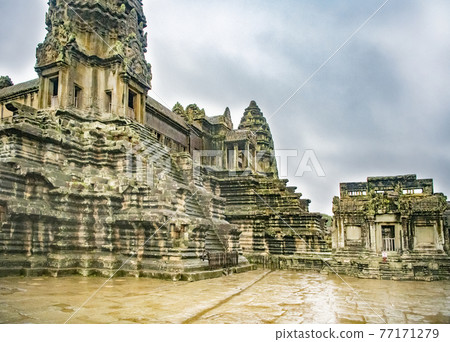 Angkor Wat is the largest temple in the world (Cambodia, 2019). It is raining 77171279