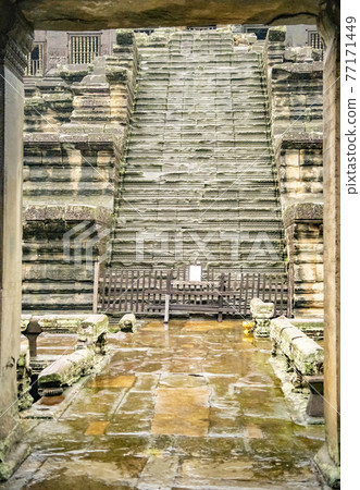 Angkor Wat is the largest temple in the world (Cambodia, 2019). It is raining 77171449