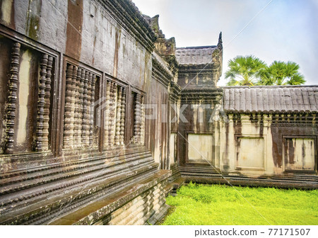 Angkor Wat is the largest temple in the world (Cambodia, 2019). It is raining 77171507