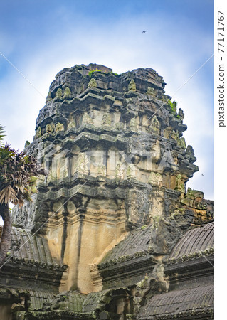 Angkor Wat is the largest temple in the world (Cambodia, 2019). It is raining Angkor Wat is the largest temple in the world (Cambodia, 2019). It is raining 77171767
