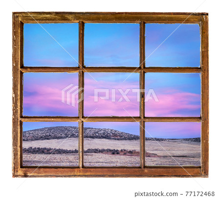 Colorado sunset sky as seen through old window Colorado sunset sky as seen through old window 77172468