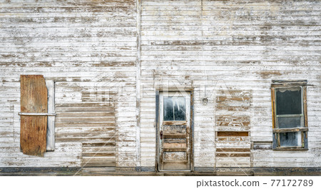 front facade of old abandoned building 77172789